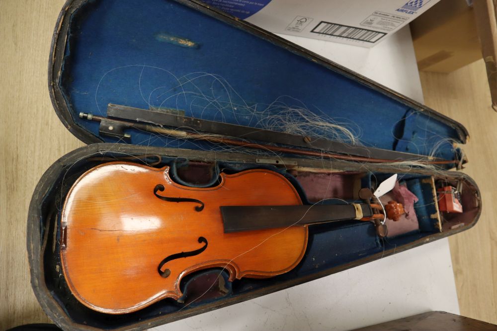 A French 3/4 size violin, Stradivarius label, with bow and accessories, in a case